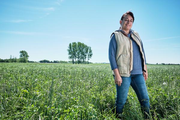 A female Canadian Dairy farmer in a field