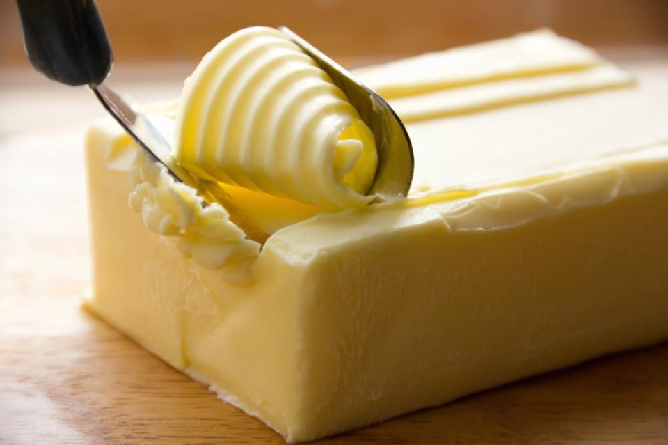 Butter being scraped off