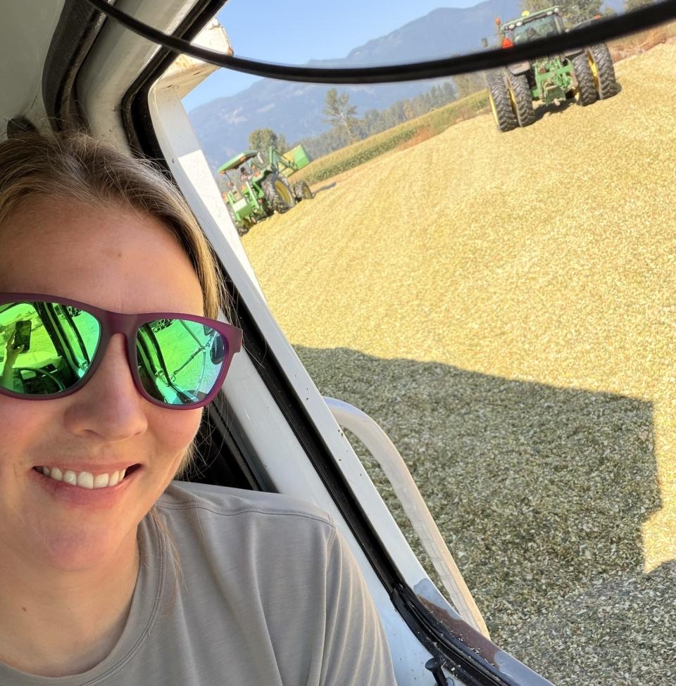 Sarah in farm vehicle