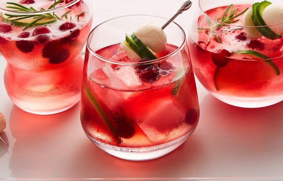 3 Cranberry & bocconcini gin tonics in glasses on top of serving tray 