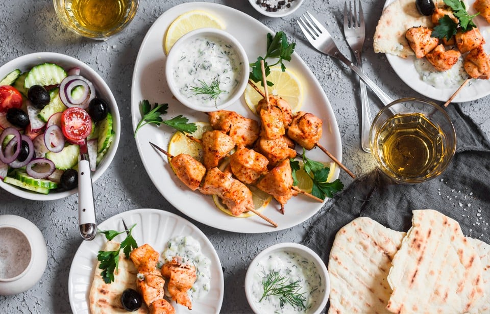 Yogurt marinated grilled chicken souvlaki with tzatziki on the side.  