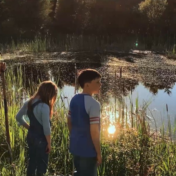 Farmer and family near wetlands